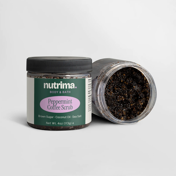 Close-up of Peppermint Coffee Scrub jar with black scrub visible, showcasing packaging design by nutrima.