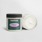 Recovery Cream in a clear jar with black lid, showcasing its smooth white texture, by nutrima.