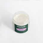 Top view of a jar of creamy white Recovery Cream with green and purple branding by nutrima.