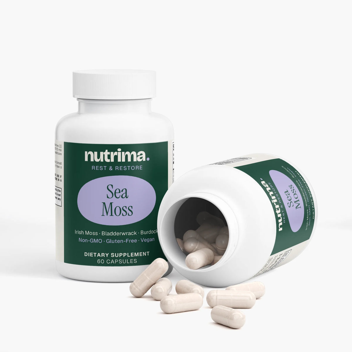 White bottle of Sea Moss dietary supplement by nutrima, featuring capsules spilled out, emphasizing its unique packaging.