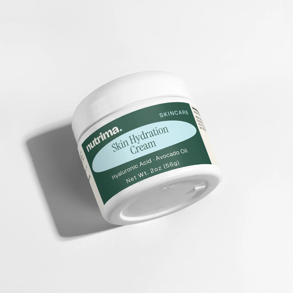 The Skin Hydration Cream features a sleek white jar with a teal label, showcasing hyaluronic acid and avocado oil by nutrima.