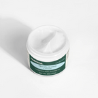 Close-up of the creamy texture in the open jar of Skin Hydration Cream by nutrima.