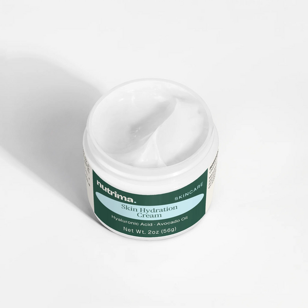Close-up of the creamy texture in the open jar of Skin Hydration Cream by nutrima.