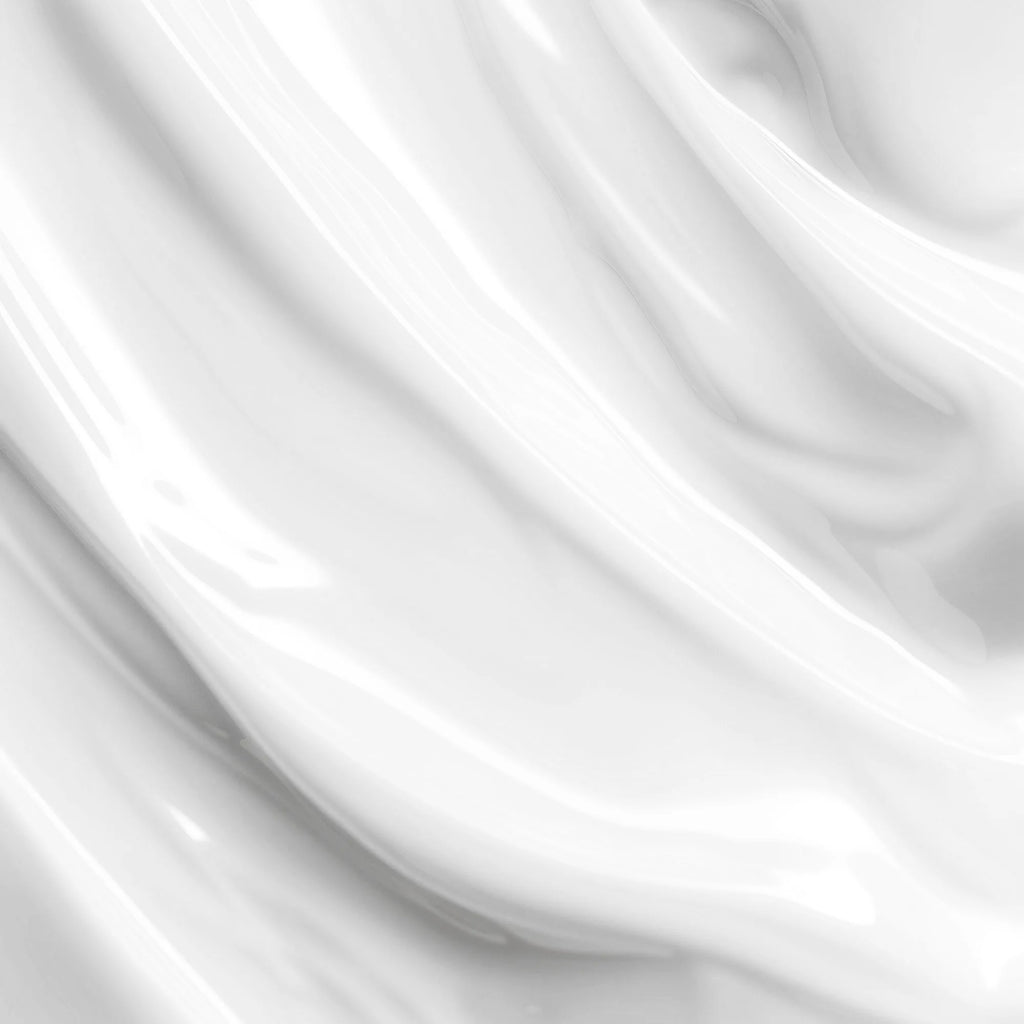 Close-up of smooth, glossy white texture of Skin Hydration Cream, featuring a silky finish by nutrima.