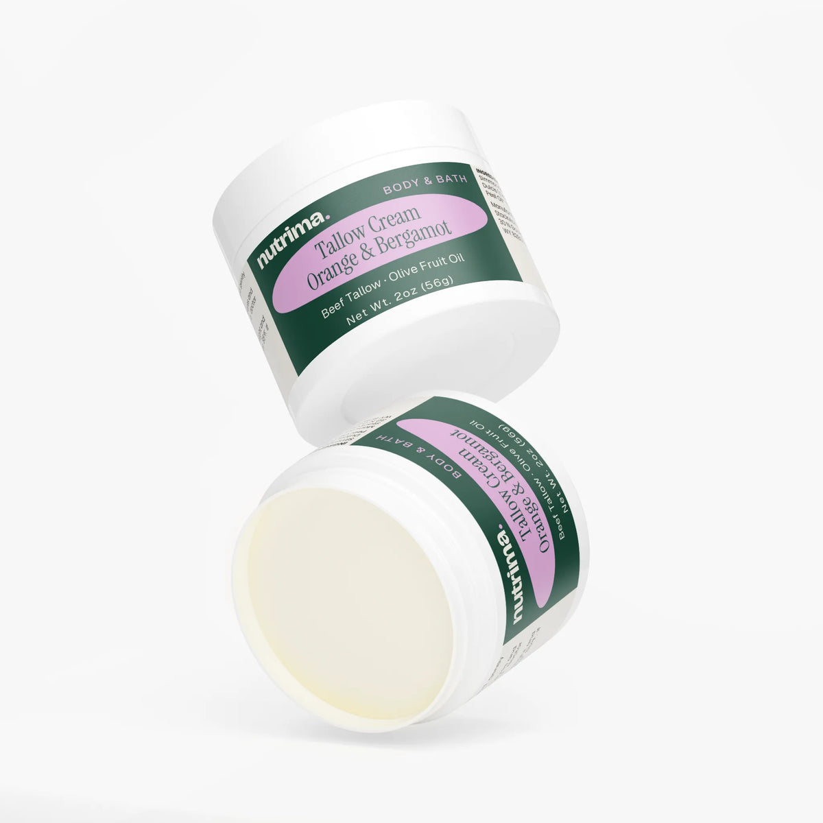 Two jars of Tallow Cream Orange & Bergamot showcasing the rich texture and elegant design by nutrima.
