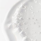 Close-up of clear water droplets creating a fresh look, highlighting Witch Hazel Pore Perfecting Toner by nutrima.